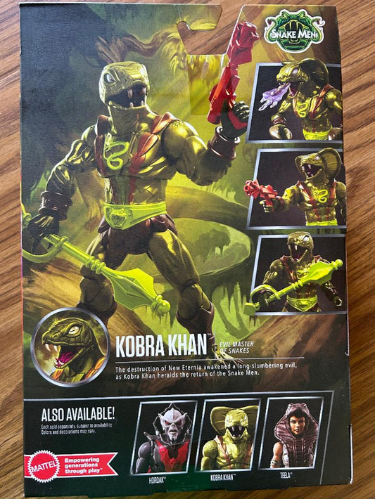 Box of Kobra Khan figure from Snake Men series on a wooden surface