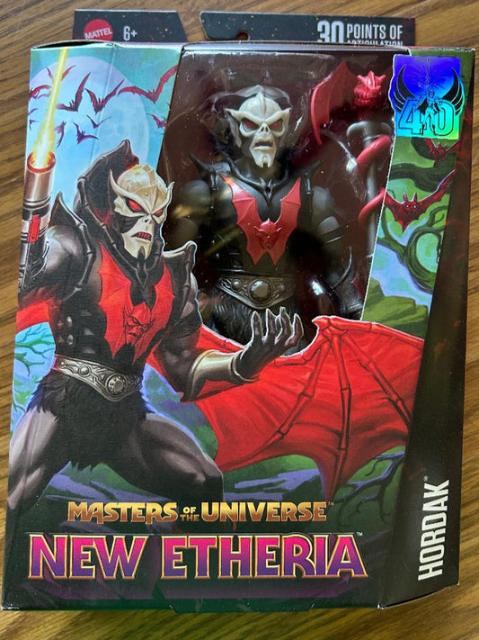 Masters of the Universe New Etheria Horndox action figure packaging on a wooden surface
