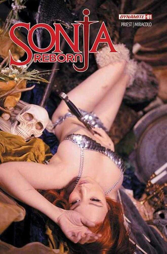 Comic book cover featuring a character in a silver bikini lying on the ground with 'Sonja Reborn' branding.
